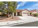 Charming single-story home with a well-manicured yard and a two-car garage at 8232 Sedona Sunset Dr, Las Vegas, NV 89128