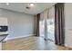 Bright living room features wood floors, sliding glass doors, and patio access at 8232 Sedona Sunset Dr, Las Vegas, NV 89128