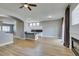 Open living space featuring a fireplace, access to the kitchen and dining areas, and backyard access at 8232 Sedona Sunset Dr, Las Vegas, NV 89128