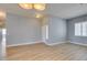 Bright living room featuring modern light fixtures and wood floors, offering a welcoming space at 8232 Sedona Sunset Dr, Las Vegas, NV 89128