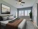 Bedroom with natural light, shutters, and light wood floors at 8232 Sedona Sunset Dr, Las Vegas, NV 89128