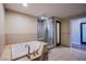 Bathroom featuring a bathtub, a walk-in shower, and a tile floor at 8925 W Flamingo Rd # 228, Las Vegas, NV 89147