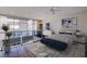 Staged bedroom featuring a loft with glass railings, natural light, and a serene atmosphere at 8925 W Flamingo Rd # 228, Las Vegas, NV 89147
