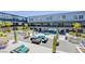 Wide angle of a modern community courtyard with multiple seating areas, grills, fire pits, lounge seating and landscaping at 8925 W Flamingo Rd # 228, Las Vegas, NV 89147