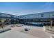 Modern community courtyard with multiple seating areas and landscaping, between two buildings, offering a tranquil outdoor space at 8925 W Flamingo Rd # 228, Las Vegas, NV 89147