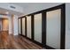 Hallway with wood-look flooring and a closet with sliding doors for ample storage at 8925 W Flamingo Rd # 228, Las Vegas, NV 89147