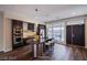 Modern open-concept kitchen featuring an island with seating, stainless steel appliances, and dark wood cabinetry at 8925 W Flamingo Rd # 228, Las Vegas, NV 89147