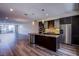 Contemporary kitchen featuring stainless steel appliances and an island with a sink at 8925 W Flamingo Rd # 228, Las Vegas, NV 89147