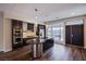 Modern kitchen with dark wood cabinets, stainless steel appliances, and granite countertops at 8925 W Flamingo Rd # 228, Las Vegas, NV 89147