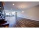Bright and spacious living area with dark, wide plank floors and contemporary lighting at 8925 W Flamingo Rd # 228, Las Vegas, NV 89147