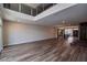 Spacious living room with high ceilings, wood floors, and an open layout flowing into the kitchen at 8925 W Flamingo Rd # 228, Las Vegas, NV 89147