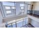Bright living space with floor-to-ceiling windows providing a stunning view of the community at 8925 W Flamingo Rd # 228, Las Vegas, NV 89147