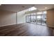 Bright and airy living room featuring large windows and hardwood floors at 8925 W Flamingo Rd # 228, Las Vegas, NV 89147