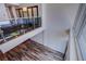 Spacious loft featuring wood floors, glass railings, and plenty of natural light at 8925 W Flamingo Rd # 228, Las Vegas, NV 89147