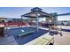 Outdoor rooftop deck has built-in grills, seating, tables, and lounge chairs, providing residents a communal space at 8925 W Flamingo Rd # 228, Las Vegas, NV 89147