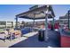 Rooftop deck features shaded seating, tables, and a built-in grill, offering a comfortable outdoor experience at 8925 W Flamingo Rd # 228, Las Vegas, NV 89147