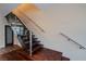 The staircase has hardwood treads, metal stringers, and stainless steel railings at 8925 W Flamingo Rd # 228, Las Vegas, NV 89147