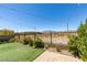 Expansive backyard with synthetic grass and string lights creating a serene outdoor space at 8977 Sweet Chestnut Ln, Las Vegas, NV 89178