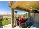 Charming outdoor patio seating area features mountain views, a ceiling fan and a patio heater at 8977 Sweet Chestnut Ln, Las Vegas, NV 89178