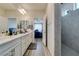 Bright bathroom featuring double sinks, spacious vanity, and a modern walk-in shower at 8977 Sweet Chestnut Ln, Las Vegas, NV 89178