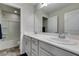 Well-lit bathroom featuring double sinks, a large mirror, and a shower-tub combination at 8977 Sweet Chestnut Ln, Las Vegas, NV 89178