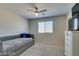 Neutral bedroom with trundle bed, a ceiling fan, and a dresser, offering comfort and functionality at 8977 Sweet Chestnut Ln, Las Vegas, NV 89178