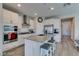 Modern kitchen with stainless steel appliances, center island, and white cabinets at 8977 Sweet Chestnut Ln, Las Vegas, NV 89178