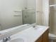 Bathroom featuring a shower with glass doors, modern vanity with dual sinks, and contemporary fixtures at 8985 S Durango Dr # 2043, Las Vegas, NV 89113