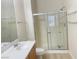 Bright bathroom featuring a glass-enclosed shower, modern vanity, and contemporary fixtures at 8985 S Durango Dr # 2043, Las Vegas, NV 89113