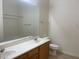 Bright bathroom featuring dual sinks, a toilet, and shower-tub combination at 8985 S Durango Dr # 2043, Las Vegas, NV 89113