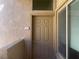 Unit entrance with a neutral-colored door, a window, and the unit number displayed at 8985 S Durango Dr # 2043, Las Vegas, NV 89113