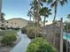 Lush walkway leading to community amenities with a view of manicured landscaping and palm trees at 8985 S Durango Dr # 2043, Las Vegas, NV 89113