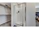 Bathroom shower with white tile and sliding glass doors and a closet with shelves at 9050 W Tropicana Ave # 1080, Las Vegas, NV 89147