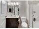 Well-lit bathroom with a vanity, mirror, toilet, and a glass-enclosed shower at 9050 W Tropicana Ave # 1080, Las Vegas, NV 89147