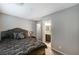 Comfortable bedroom featuring a bed and an ensuite bathroom at 9050 W Tropicana Ave # 1080, Las Vegas, NV 89147