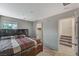 Spacious bedroom featuring a comfortable bed and natural light with easy access to closet and stairs at 9050 W Tropicana Ave # 1080, Las Vegas, NV 89147