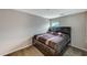 Cozy bedroom featuring a comfortable bed and soft carpet flooring and natural light from a window at 9050 W Tropicana Ave # 1080, Las Vegas, NV 89147