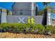 Attractive X-it community sign surrounded by lush landscaping, adding a welcoming touch to the entrance at 9050 W Tropicana Ave # 1080, Las Vegas, NV 89147
