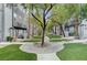 Beautifully landscaped front yard with walking paths and mature trees enhance curb appeal of this townhome community at 9050 W Tropicana Ave # 1080, Las Vegas, NV 89147