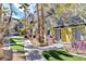 Beautifully landscaped common area with vibrant flowers and lush greenery, adding a touch of nature to this complex at 9050 W Tropicana Ave # 1080, Las Vegas, NV 89147