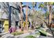 Attractive condo buildings with palm trees and inviting walkway, offering a tranquil and appealing setting at 9050 W Tropicana Ave # 1080, Las Vegas, NV 89147