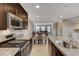 Modern kitchen with stainless steel appliances, dark wood cabinets and granite counters at 9050 W Tropicana Ave # 1080, Las Vegas, NV 89147