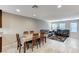 Open-concept living area features stylish dining table and comfortable leather sofas at 9050 W Tropicana Ave # 1080, Las Vegas, NV 89147