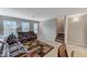 Inviting living room features comfortable leather seating, natural light, and a cozy atmosphere at 9050 W Tropicana Ave # 1080, Las Vegas, NV 89147