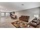 Open-concept living area with a sofa, dining area, and a view of the kitchen at 9050 W Tropicana Ave # 1080, Las Vegas, NV 89147