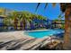 Sparkling community pool with lounge chairs and a patio, ideal for enjoying sunny days at 9050 W Tropicana Ave # 1080, Las Vegas, NV 89147