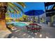 Inviting community pool area with ample seating and shade, perfect for relaxing and socializing at 9050 W Tropicana Ave # 1080, Las Vegas, NV 89147