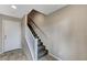 Clean staircase featuring carpeted steps and a white handrail leading to the upper level at 9050 W Tropicana Ave # 1080, Las Vegas, NV 89147
