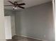 Comfortable bedroom with neutral tones, ceiling fan, and closet, offering a relaxing retreat at 10067 Sand Key St, Las Vegas, NV 89178