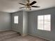 Bedroom with plush carpeting and two bright windows with blinds at 10067 Sand Key St, Las Vegas, NV 89178